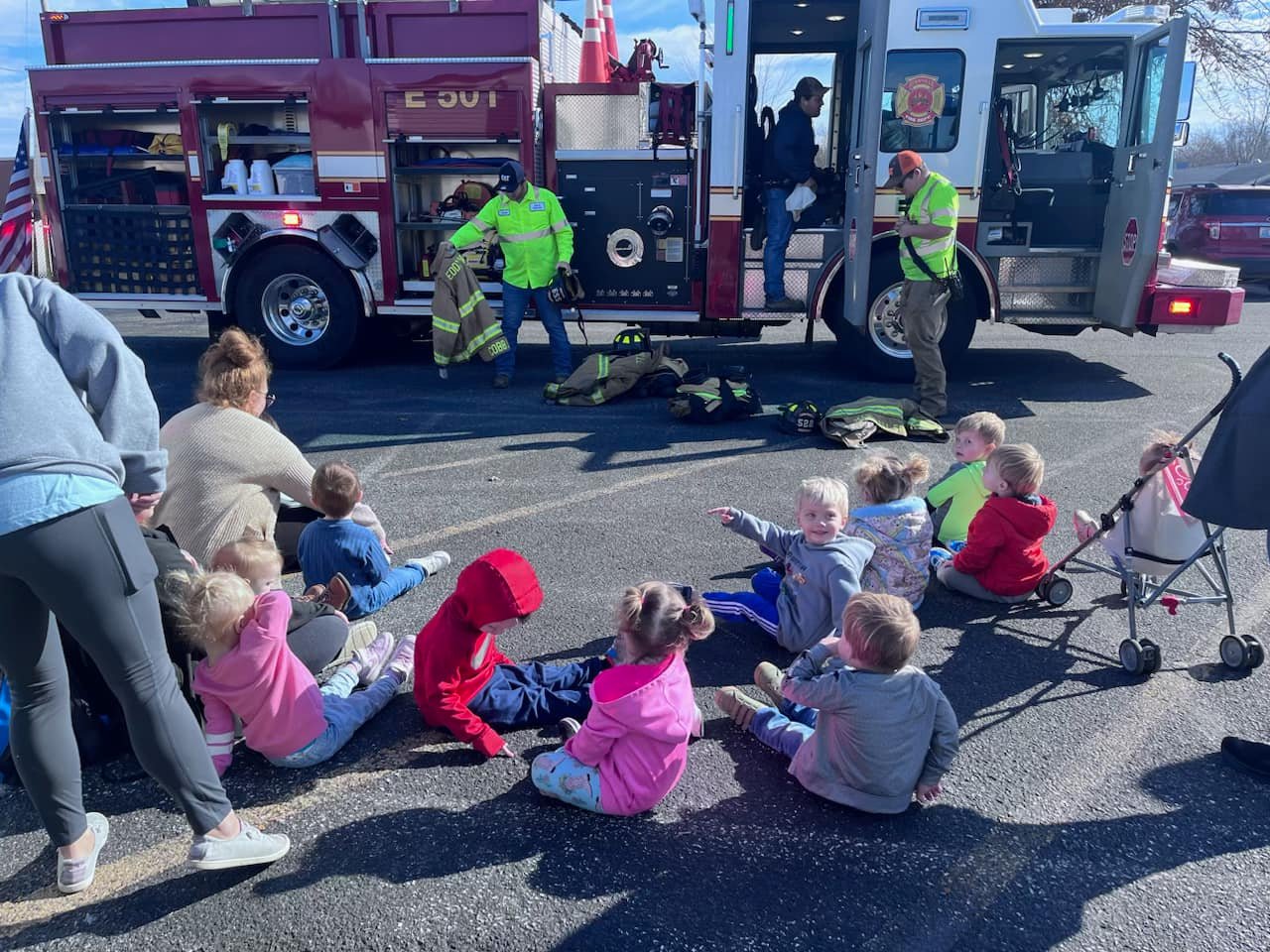 Photo of children with firemen