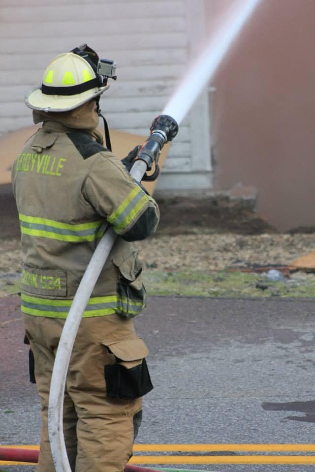 Photo of fireman with hose