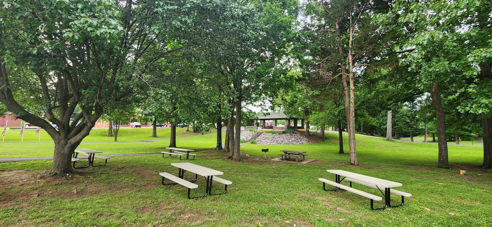 Photos of the park area with benches and picnic tables