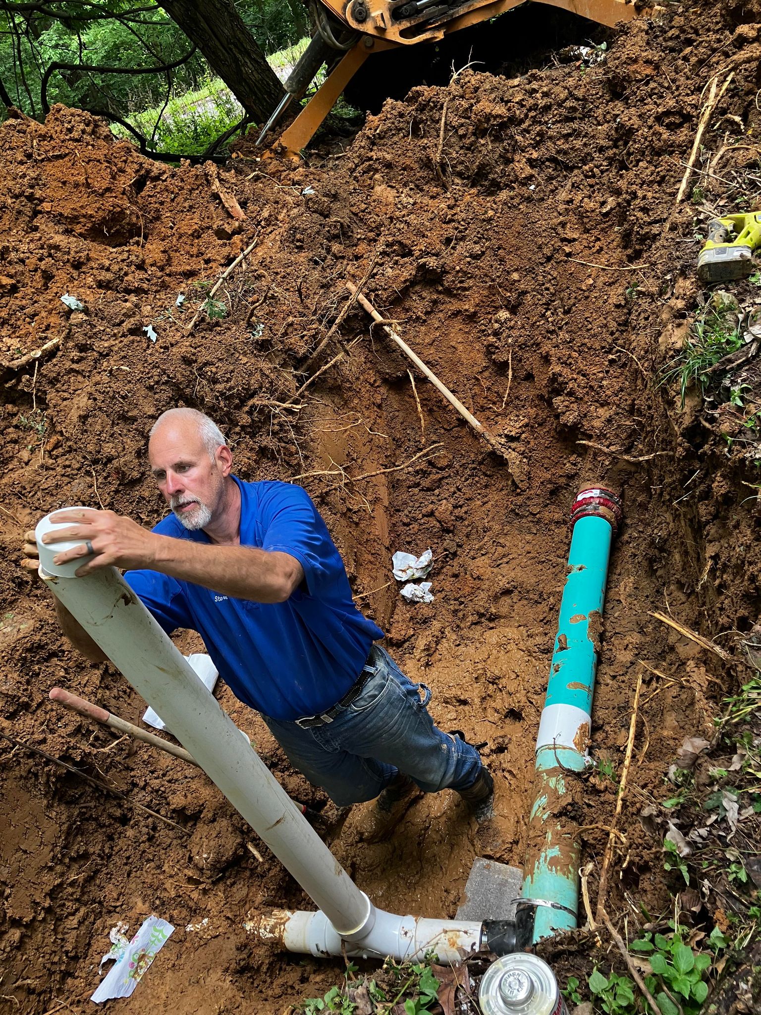 Photo of worker installing a water pipe